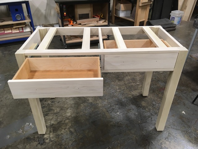 A handmade frame for a custom desk, with 2 drawers